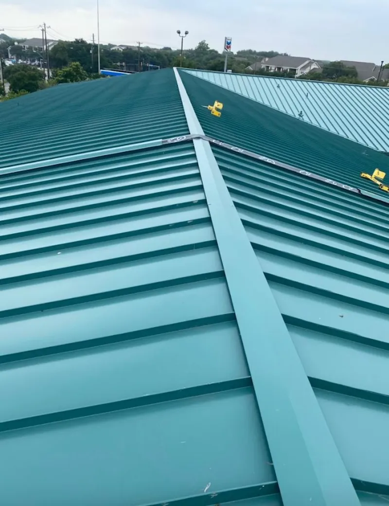 Green commercial metal roof ridge and valley for Metal Roof Repair in Bellevue